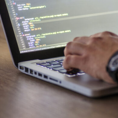 a man writes code for a web program.