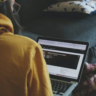 macbook pro on persons lap