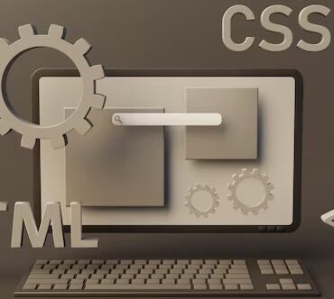 Web page programming elements next to computer