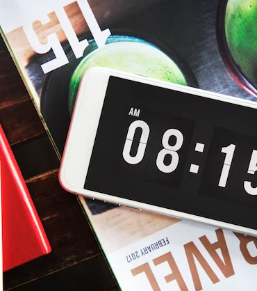 The phone is lying on the table with a timer